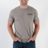 Light-gray t-shirt, front with  James Bean written on the left peck. Man is using the shirt.