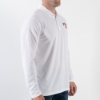 A man wearing the white polo shirt seen from the side.