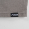 Close-up of the shirt's tag, written JAMES B BEAN in white on black background.