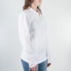 A side view of a woman wearing a polo.