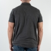 The black polo shirt, viewed from the back. A man is wearing it.