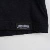 Close-up of the shirt's tag, written "James B. Beam" in white on a black background.