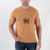 A man wearing the shirt with one hand in his pocket.