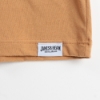 Close-up of the shirt's tag. A white rectangle with "James B. Beam" written in black.
